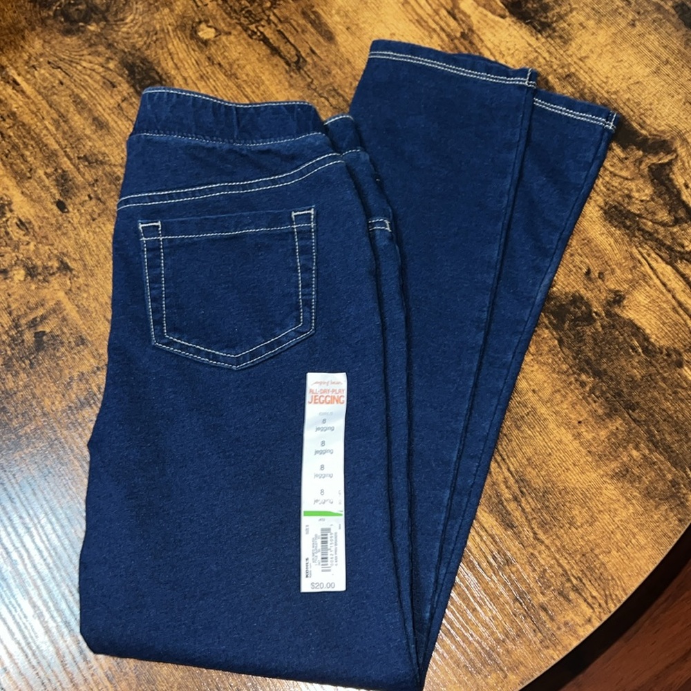 6 tank tops (7/8), one pair of jeggings (size 8) and one pair of leggings (7/8)